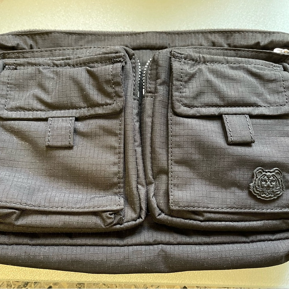 Black/ multicolored belt Bag that converts into a backpack.